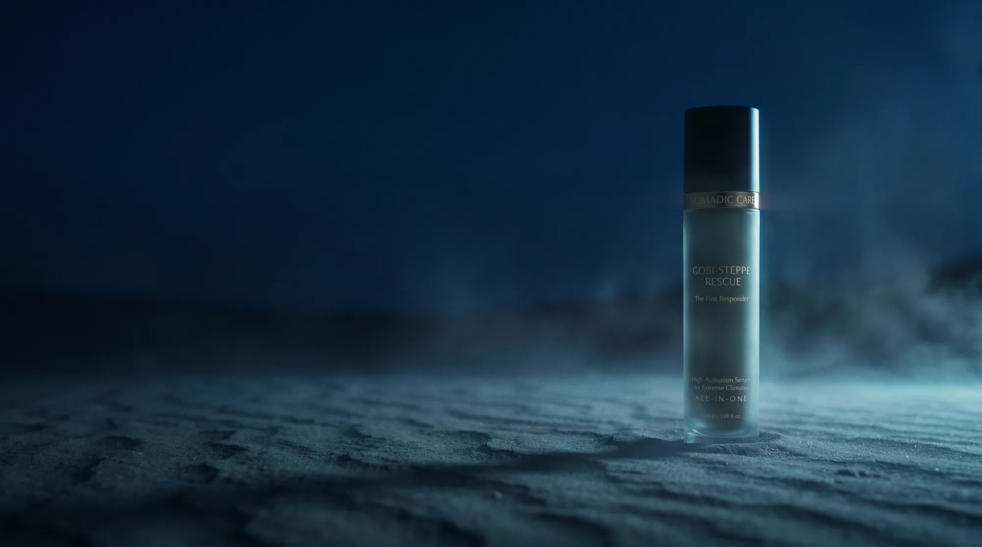 The Gobi-Steppe Rescue serum bottle standing on dark Gobi sand at the cold blue hour, glacial light grazing the frosted glass